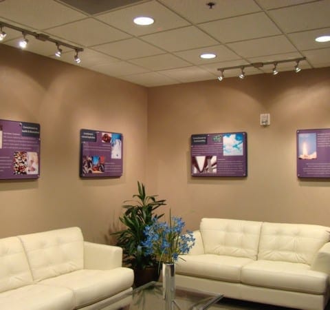 Custom informational acrylic mounted graphics in commercial lobbies by Holt Environments
