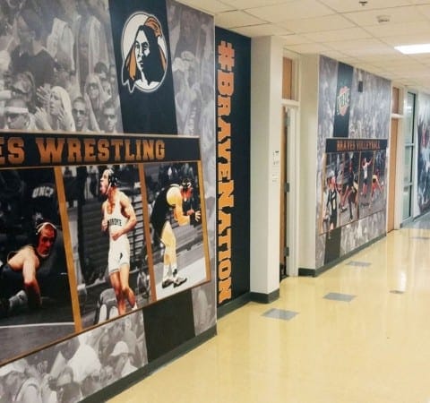 Custom high resolution graphics for college sports commercial interior design by Holt Environments