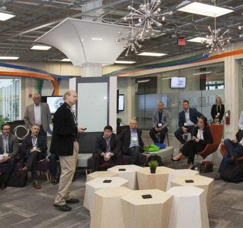 Innovation lab at Inmar with custom organic shape table and indoor tension fabric clouds architecture