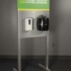 Freestanding branded hygiene station with hand sanitizer and wipes